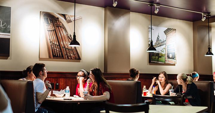 students eating in a restaurant